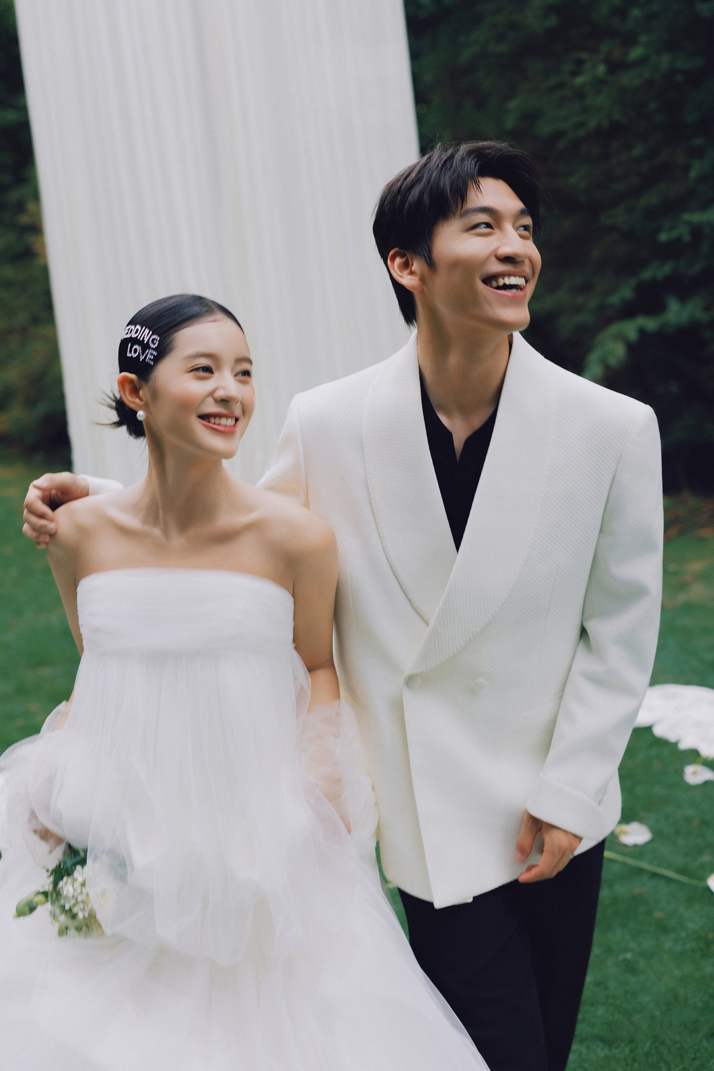 Couple smiling together in a garden